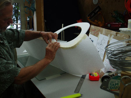 Shaping and Taping 1/16 inch foam panels around eye openings.