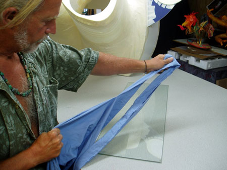 Tearing cotton sheets into strips. Cloth is a much stronger material to use for a base coat.