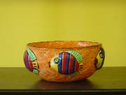 small orange fish bowl by Andrea Charendoff