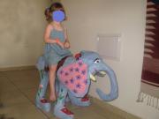 a girl on an elephant by Rina Ofir