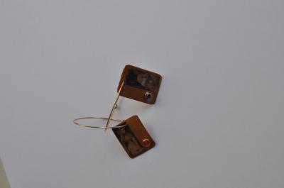"Recycled paper gold earrings with red stone image of a woman - her mouth" by Minna Ben-Nun