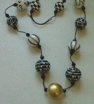 "gilded and handpainted beads" by Evangeline Duplessis