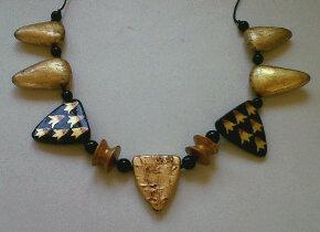 "hand painted+ gilded beads spaced with small onyx beads" by Evangeline Duplessis