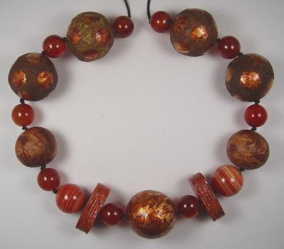 "Rust coloured papier mache bead necklace" by Evangeline Duplessis