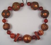 Rust coloured papier mache bead necklace by Evangeline Duplessis