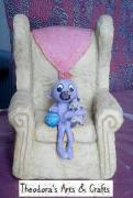 Cutie Baby On Sofa Chair by Theodora Spanides