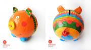 Orange pig money box by Efthimia Kotsanelou